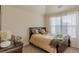 Cozy bedroom with natural light, carpet, and wood furniture creates a relaxing atmosphere at 879 Tranquil Way, Hampton, GA 30228