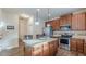 Kitchen with stainless steel appliances, granite counters, and a central island at 879 Tranquil Way, Hampton, GA 30228