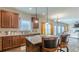 Open kitchen showcasing stainless appliances, granite counters, and seamless living room access at 879 Tranquil Way, Hampton, GA 30228