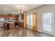 Eat-in kitchen boasts stainless steel appliances, an island, and ample counter space at 879 Tranquil Way, Hampton, GA 30228