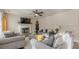 Inviting living room with fireplace, ceiling fan, and comfortable seating arrangement at 879 Tranquil Way, Hampton, GA 30228