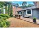 Backyard features a wooden deck with a custom table and a well-manicured gravel area at 935 Cumberland Ne Rd, Atlanta, GA 30306