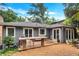 Beautiful backyard featuring a spacious wooden deck and a custom stone table at 935 Cumberland Ne Rd, Atlanta, GA 30306