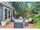 Cozy outdoor seating area on gravel patio, surrounded by lush greenery at 935 Cumberland Ne Rd, Atlanta, GA 30306