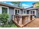 Back deck features custom outdoor kitchen space with a grill at 935 Cumberland Ne Rd, Atlanta, GA 30306