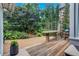 Outdoor deck features a custom concrete table, grill, and lush landscaped garden at 935 Cumberland Ne Rd, Atlanta, GA 30306