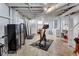 Unfinished basement area featuring exposed pipes, concrete floor, and ample space for storage or recreation at 935 Cumberland Ne Rd, Atlanta, GA 30306