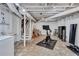 Unfinished basement with painted ceiling, concrete floors, and utility area with stairs leading to upper levels at 935 Cumberland Ne Rd, Atlanta, GA 30306