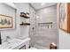 Modern bathroom with a walk-in shower, sleek fixtures, floating shelves, and recessed lighting at 935 Cumberland Ne Rd, Atlanta, GA 30306