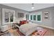 Bright bedroom featuring hardwood floors, a large window, neutral walls, and a patterned rug at 935 Cumberland Ne Rd, Atlanta, GA 30306