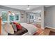 Spacious bedroom with hardwood floors, a large window, and mirrored closet doors at 935 Cumberland Ne Rd, Atlanta, GA 30306