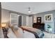 Comfortable bedroom featuring neutral walls, a sliding door, and stylish furnishings at 935 Cumberland Ne Rd, Atlanta, GA 30306