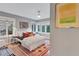 Bright bedroom with hardwood floors, modern decor, and ample natural light at 935 Cumberland Ne Rd, Atlanta, GA 30306