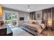 Cozy bedroom with direct patio access, soft lighting, plush bedding, and a patterned rug at 935 Cumberland Ne Rd, Atlanta, GA 30306