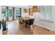Inviting dining area with hardwood floors, stylish lighting, and ample natural light streaming through the windows at 935 Cumberland Ne Rd, Atlanta, GA 30306