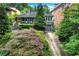 Charming home featuring a well-manicured front yard with beautiful landscaping at 935 Cumberland Ne Rd, Atlanta, GA 30306