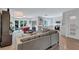 Open-concept living space with a modern kitchen, comfortable seating, and access to the outdoors at 935 Cumberland Ne Rd, Atlanta, GA 30306