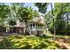 Backyard featuring a screened porch and lush greenery at 2375 Hyde Park Nw Ct, Atlanta, GA 30318