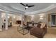 Finished basement living area with comfortable seating, bar and elegant lighting at 2375 Hyde Park Nw Ct, Atlanta, GA 30318