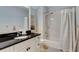 Bathroom featuring vanity with granite counters and shower with curtain at 2375 Hyde Park Nw Ct, Atlanta, GA 30318