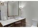 Modern half-bathroom featuring marble vanity, stylish lighting, and contemporary fixtures at 2375 Hyde Park Nw Ct, Atlanta, GA 30318