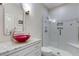 Modern bathroom featuring a sleek glass shower and a vessel sink with elegant fixtures at 2375 Hyde Park Nw Ct, Atlanta, GA 30318