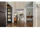 Elegant foyer with hardwood floors, stately columns, and a glimpse of the staircase at 2375 Hyde Park Nw Ct, Atlanta, GA 30318