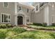 A beautifully landscaped front entrance with a manicured lawn and brick walkway leading to the front door at 2375 Hyde Park Nw Ct, Atlanta, GA 30318