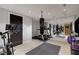 Home gym with mirrored wall, treadmill, punching bag, and exercise bike at 2375 Hyde Park Nw Ct, Atlanta, GA 30318