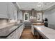 Spacious kitchen with granite countertops, a modern island, and high-end appliances at 2375 Hyde Park Nw Ct, Atlanta, GA 30318