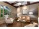 Comfortable living room featuring detailed ceiling, hardwood floors, and a large window at 2375 Hyde Park Nw Ct, Atlanta, GA 30318