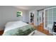 Bright bedroom featuring hardwood floors, and a walk-in closet with sliding barn door at 2023 Oakview Se Rd # 226, Atlanta, GA 30317