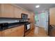 Bright kitchen with stainless steel appliances, granite countertops, and hardwood floors at 2023 Oakview Se Rd # 226, Atlanta, GA 30317