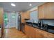 Well-lit kitchen with granite countertops, stainless steel appliances, and wooden cabinets at 2023 Oakview Se Rd # 226, Atlanta, GA 30317