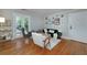 Bright living room with hardwood floors, modern furniture, and access to a balcony at 2023 Oakview Se Rd # 226, Atlanta, GA 30317