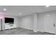 Finished basement with recessed lights, tv, and access to the exterior at 2095 Honeysuckle Dr, Cumming, GA 30040