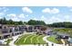 Aerial view of Gathering-friendly City Center with splash pad, playground, and green spaces at 2095 Honeysuckle Dr, Cumming, GA 30040