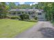 Charming home featuring a large front porch, dormer windows, and an attached two-car garage at 2095 Honeysuckle Dr, Cumming, GA 30040