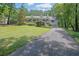 Charming one-story home featuring a welcoming front porch and a well-maintained lawn at 2095 Honeysuckle Dr, Cumming, GA 30040