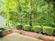 Green backyard featuring lush trees and bushes at 3150 Stratford Green Pl, Avondale Estates, GA 30002