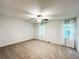 Spacious bedroom with ceiling fan, carpet floors and bright natural light from two windows at 3150 Stratford Green Pl, Avondale Estates, GA 30002