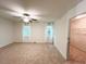 Bedroom with natural light boasts carpet, window views and adjoining walk-in closet at 3150 Stratford Green Pl, Avondale Estates, GA 30002