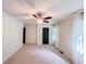Bright bedroom with neutral carpet, white walls, large windows, and contemporary ceiling fan at 3150 Stratford Green Pl, Avondale Estates, GA 30002