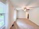 Open bedroom featuring neutral carpet, bright light, and a modern ceiling fan at 3150 Stratford Green Pl, Avondale Estates, GA 30002