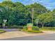 Stratford Green Townhomes entrance with lush greenery and welcoming signage at 3150 Stratford Green Pl, Avondale Estates, GA 30002