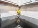 A black countertop with white subway tile backsplash and a vase of lemons on the counter at 3150 Stratford Green Pl, Avondale Estates, GA 30002
