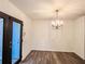 Chandelier lit dining room with view of entry door at 3150 Stratford Green Pl, Avondale Estates, GA 30002