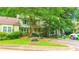 Charming townhouse with well-maintained lawn, mature tree, and parking at 3150 Stratford Green Pl, Avondale Estates, GA 30002