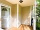 Inviting covered porch showcases white railings, ample space, and clean lines at 3150 Stratford Green Pl, Avondale Estates, GA 30002
