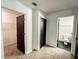 Hallway with multiple doorways, including entrances to a closet and bathroom at 3150 Stratford Green Pl, Avondale Estates, GA 30002